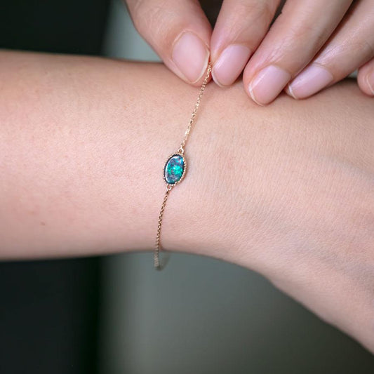 Oval Shaped Australian Boulder Opal Bracelet in 18K Yellow Gold