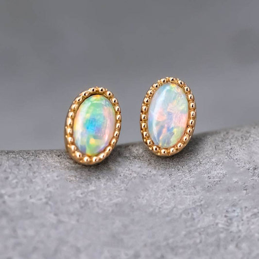 Delicate Oval Shaped Opal Stud Earrings 18K Yellow Gold