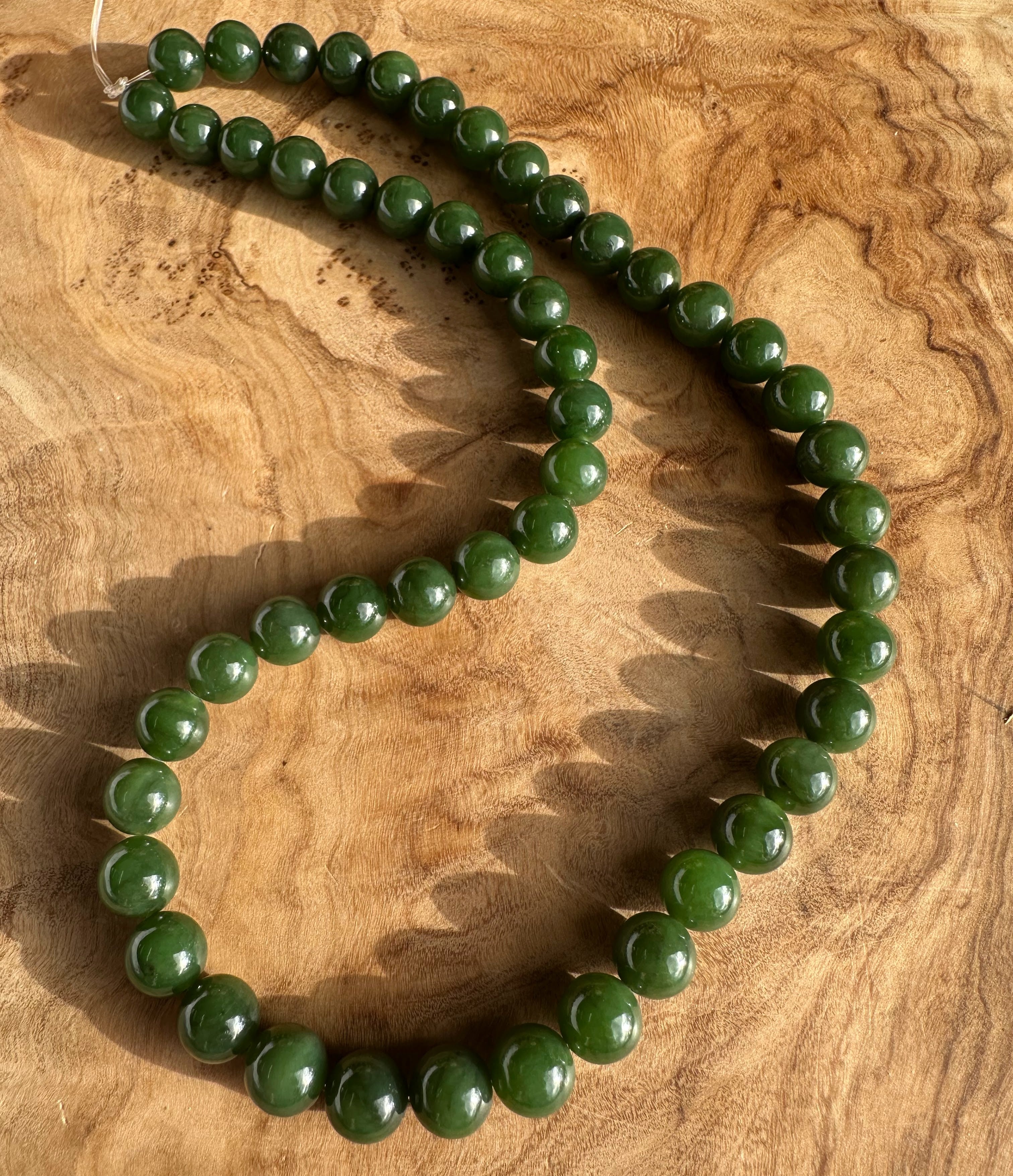 8mm Dark Green Canadian Unstrung Beads, 16"
